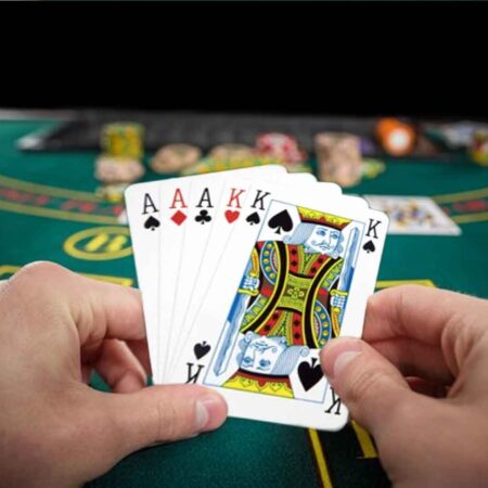 Who wins in Poker when both players have a Full House?